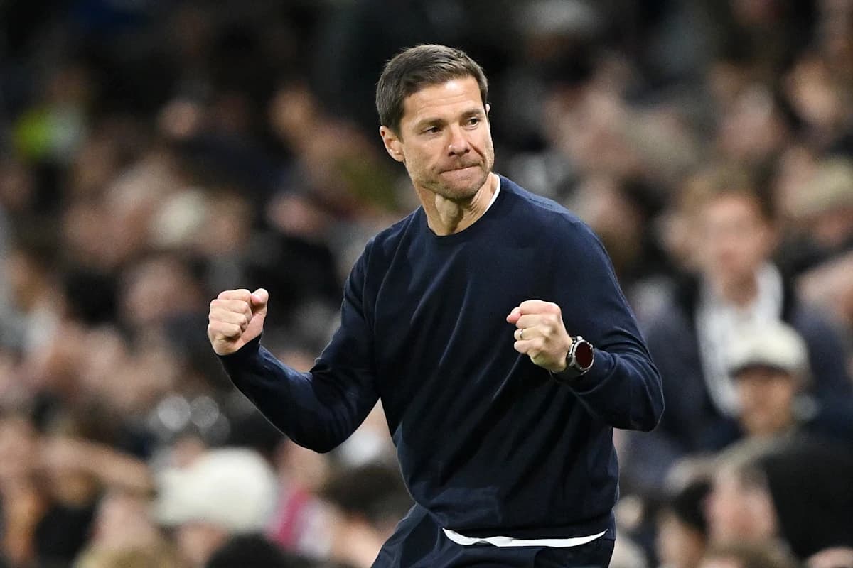Xabi Alonso celebrating Chelsea's victory over Fulham on the touchline.